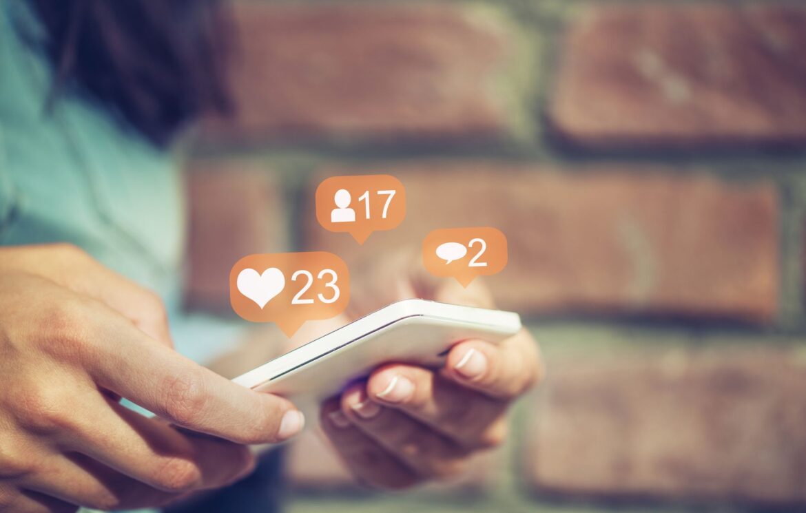 young-girl-using-smart-phone-social-media-concept-royalty-free-image-673485188-1558548948